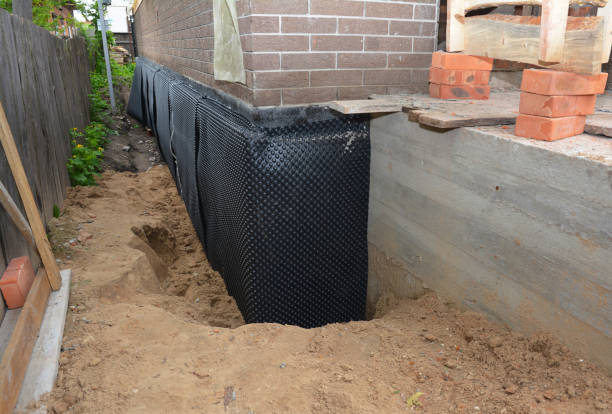 SJ Waterproofing Pros technician performing targeted Waterproofing assessment in Richmond, IN